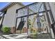 Unique entryway with modern metal canopy and decorative iron gates to access a brick-paved courtyard at 701 W Trinity Ave # 116, Durham, NC 27701