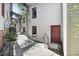 Inviting exterior of the townhome featuring private entrance, muted siding and climbing vines at 701 W Trinity Ave # 116, Durham, NC 27701