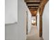 Hallway with exposed beams and inviting view of living room at 701 W Trinity Ave # 116, Durham, NC 27701