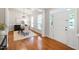 Bright dining room with hardwood floors and views of the front yard at 704 Voyager Pl, Durham, NC 27712