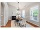 Charming dining room featuring a modern chandelier and large windows at 704 Voyager Pl, Durham, NC 27712