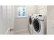 Bright laundry room with side-by-side washer and dryer units and window at 704 Voyager Pl, Durham, NC 27712