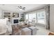 Comfortable living room with built-in bookshelves, fireplace, and natural light at 704 Voyager Pl, Durham, NC 27712
