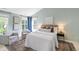 Spacious main bedroom features large windows, a plush rug, and a sitting area at 704 Voyager Pl, Durham, NC 27712
