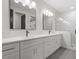 Stylish bathroom with double vanity, marble countertops, modern fixtures, and spacious glass-enclosed shower at 730 Hopkins St, Durham, NC 27701