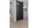 Stylish bathroom features a modern barn door, sleek vanity, and contemporary fixtures at 730 Hopkins St, Durham, NC 27701