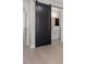 Stylish bathroom features a modern barn door, sleek vanity, and contemporary fixtures at 730 Hopkins St, Durham, NC 27701
