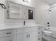 Elegant bathroom with double sink vanity, large mirror, and a combined tub and shower with modern fixtures at 730 Hopkins St, Durham, NC 27701