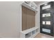 Welcoming entryway features built-in storage bench, shelving, and a modern wooden accent wall at 730 Hopkins St, Durham, NC 27701