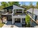 Stunning exterior view of a modern home with a two-car garage and spacious balcony at 730 Hopkins St, Durham, NC 27701