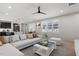 Spacious living room with bright windows, hardwood floors, and an open concept kitchen at 730 Hopkins St, Durham, NC 27701