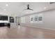 Spacious living room featuring hardwood floors, modern lighting, and a large window providing natural light at 730 Hopkins St, Durham, NC 27701