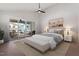 Serene main bedroom with sliding doors to the outdoor deck, vaulted ceiling, and a calming color palette at 730 Hopkins St, Durham, NC 27701