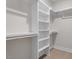 Bright walk-in closet features custom built-in shelving and clothing racks for optimal organization at 730 Hopkins St, Durham, NC 27701
