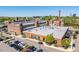 Aerial view of large mill with water tower, city skyline, and parking lot filled with cars at 732 Hopkins St, Durham, NC 27701