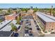 Aerial view of mill with brick construction, parking lot, and the city skyline at 732 Hopkins St, Durham, NC 27701