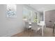 Cozy dining area with large window, modern furniture, and ample natural light at 732 Hopkins St, Durham, NC 27701