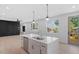 Bright, open kitchen with a large island, stainless steel appliances, and natural light at 732 Hopkins St, Durham, NC 27701