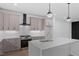 Well-appointed kitchen with a central island, modern appliances, and ample cabinet space at 732 Hopkins St, Durham, NC 27701