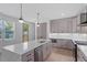 Spacious kitchen boasts a large island, stainless steel appliances, and modern finishes at 732 Hopkins St, Durham, NC 27701