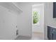 Bright laundry area featuring modern cabinetry, a large window, and new appliances at 732 Hopkins St, Durham, NC 27701