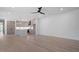 Open-concept living space featuring hardwood floors and seamless kitchen integration at 732 Hopkins St, Durham, NC 27701