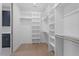 White open shelving in a walk-in closet with blue cabinet at 732 Hopkins St, Durham, NC 27701