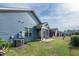 Home's exterior featuring a screened porch and well-maintained yard at 74 Revelstoke Dr, Garner, NC 27529
