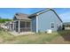 Well-maintained backyard with a screened porch at 74 Revelstoke Dr, Garner, NC 27529