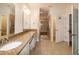 Bright bathroom features double sinks, granite countertops, and a walk-in glass enclosed shower at 74 Revelstoke Dr, Garner, NC 27529