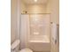This bathroom features a white shower-tub with a shower curtain and white toilet at 74 Revelstoke Dr, Garner, NC 27529
