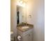 Bathroom featuring a vanity with granite countertop and stylish fixtures at 74 Revelstoke Dr, Garner, NC 27529