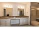 Spacious bathroom features double sinks, granite countertops, and glass enclosed shower at 74 Revelstoke Dr, Garner, NC 27529