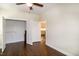 Large bedroom featuring hardwood floors, an open closet, and an open door to the kitchen at 74 Revelstoke Dr, Garner, NC 27529
