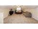 Spacious bedroom featuring a decorative four-poster bed and comfortable seating area at 74 Revelstoke Dr, Garner, NC 27529