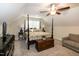 Cozy bedroom with a four-poster bed, ceiling fan, and chest in a carpeted room at 74 Revelstoke Dr, Garner, NC 27529