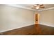 Bedroom features trey ceiling and ceiling fan, with an en suite bathroom at 74 Revelstoke Dr, Garner, NC 27529