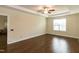 Bedroom features trey ceiling and ceiling fan, and a large window for plenty of natural light at 74 Revelstoke Dr, Garner, NC 27529