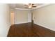 Bedroom with trey ceiling has several doors leading to en suite bathroom and closets at 74 Revelstoke Dr, Garner, NC 27529