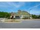 Well-maintained community clubhouse featuring neutral siding, manicured lawns, and accessible parking spaces at 74 Revelstoke Dr, Garner, NC 27529