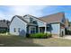 Charming two-story home featuring stone accents, a well-manicured lawn, and inviting curb appeal at 74 Revelstoke Dr, Garner, NC 27529