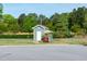 Charming greenspace park building set amongst lush landscaping and mature trees on a sunny day at 74 Revelstoke Dr, Garner, NC 27529