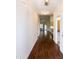 An inviting hallway features hardwood floors and neutral paint, leading to various rooms throughout the house at 74 Revelstoke Dr, Garner, NC 27529