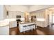 Bright kitchen with granite counters, island with seating, and stainless steel appliances at 74 Revelstoke Dr, Garner, NC 27529