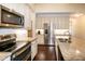 Modern kitchen with granite counters, stainless steel appliances, and ample cabinet space at 74 Revelstoke Dr, Garner, NC 27529