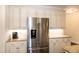 Kitchen with stainless steel refrigerator and granite countertops with white subway tile backsplash at 74 Revelstoke Dr, Garner, NC 27529