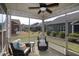 Inviting screened porch with comfortable seating, string lights, overlooking a landscaped backyard at 74 Revelstoke Dr, Garner, NC 27529
