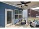Cozy screened porch featuring cushioned wicker chairs, side table and outdoor access at 74 Revelstoke Dr, Garner, NC 27529