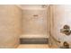 Walk-in shower features tiled walls, built in bench, and mounted shower head at 74 Revelstoke Dr, Garner, NC 27529
