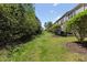 A spacious backyard featuring lush green grass, perfect for outdoor activities and relaxation at 7613 Satinwing Ln, Raleigh, NC 27617
